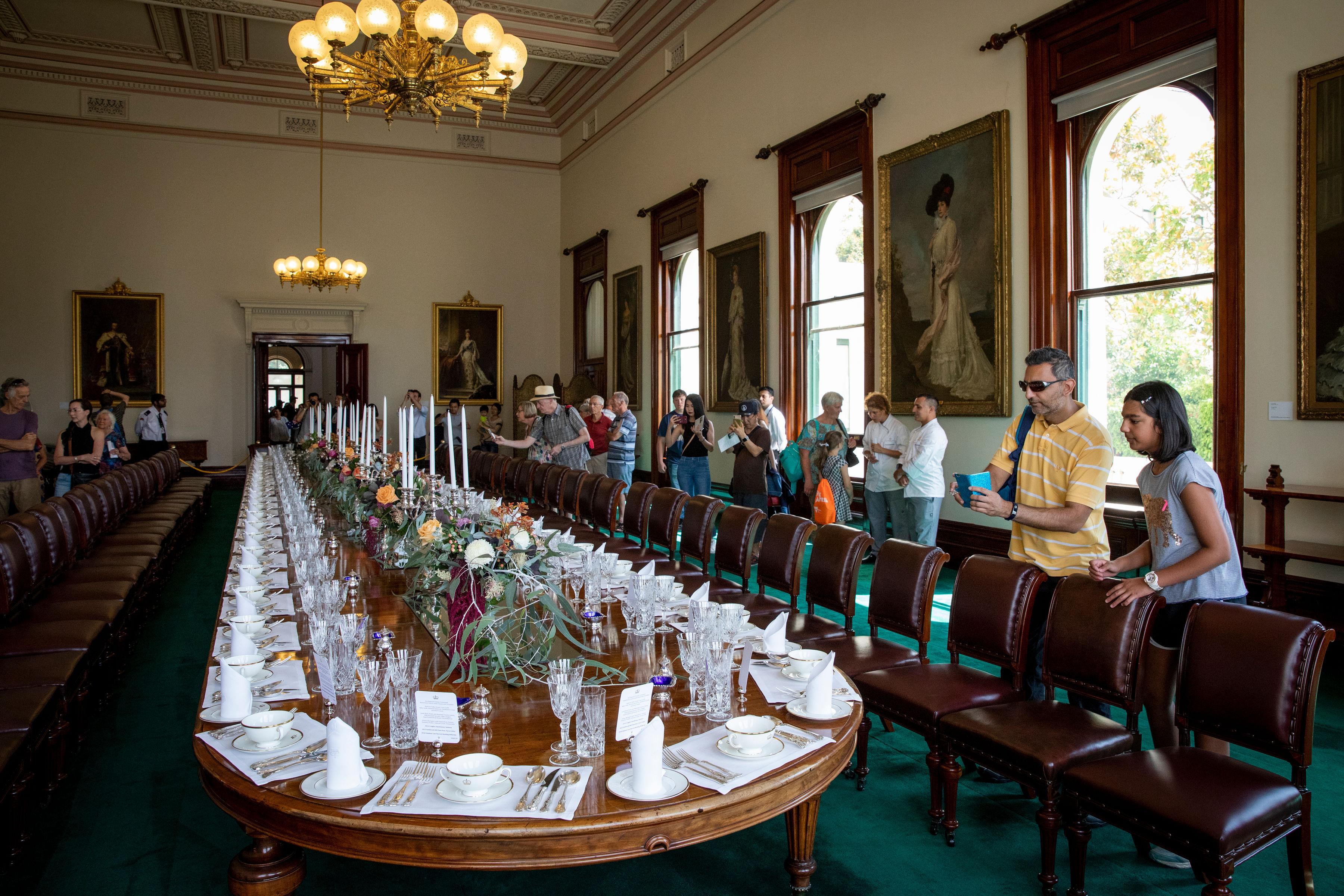 Visitors in the State Dining Room as part of a self-guided tour of the State Apartments. 