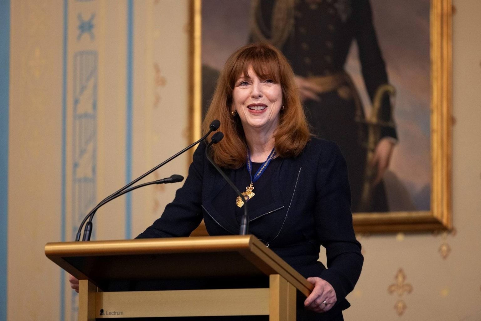 Governor giving speech at lectern for the King's Birthday Investiture Ceremony at Government House.