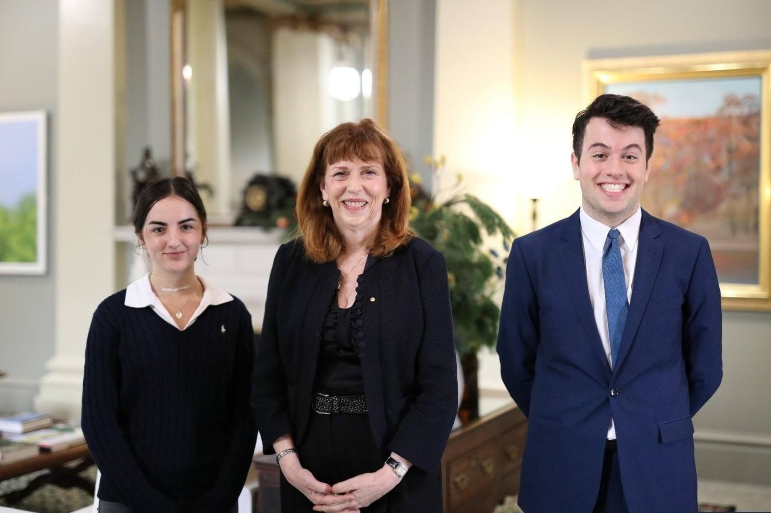 The Governor and two students undertaking work experience at the Office of the Governor pose for a photo.
