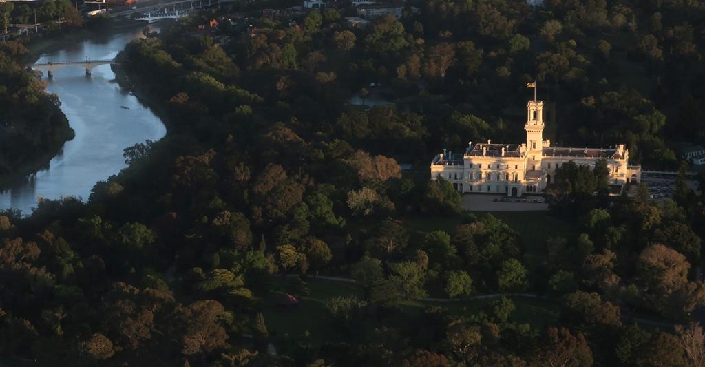 Birds eye view of Government House surrounded by parkland