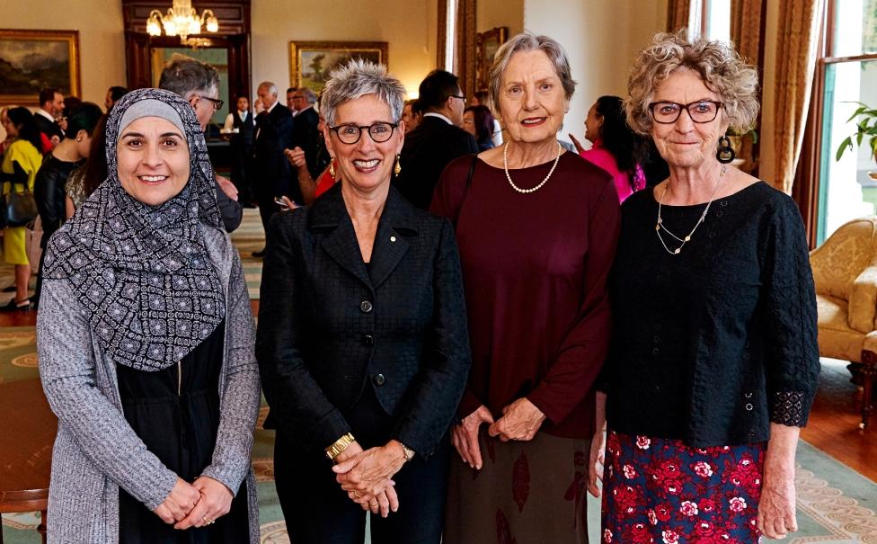 The Governor with three women who feature in the Grandmothers' Project exhibitions