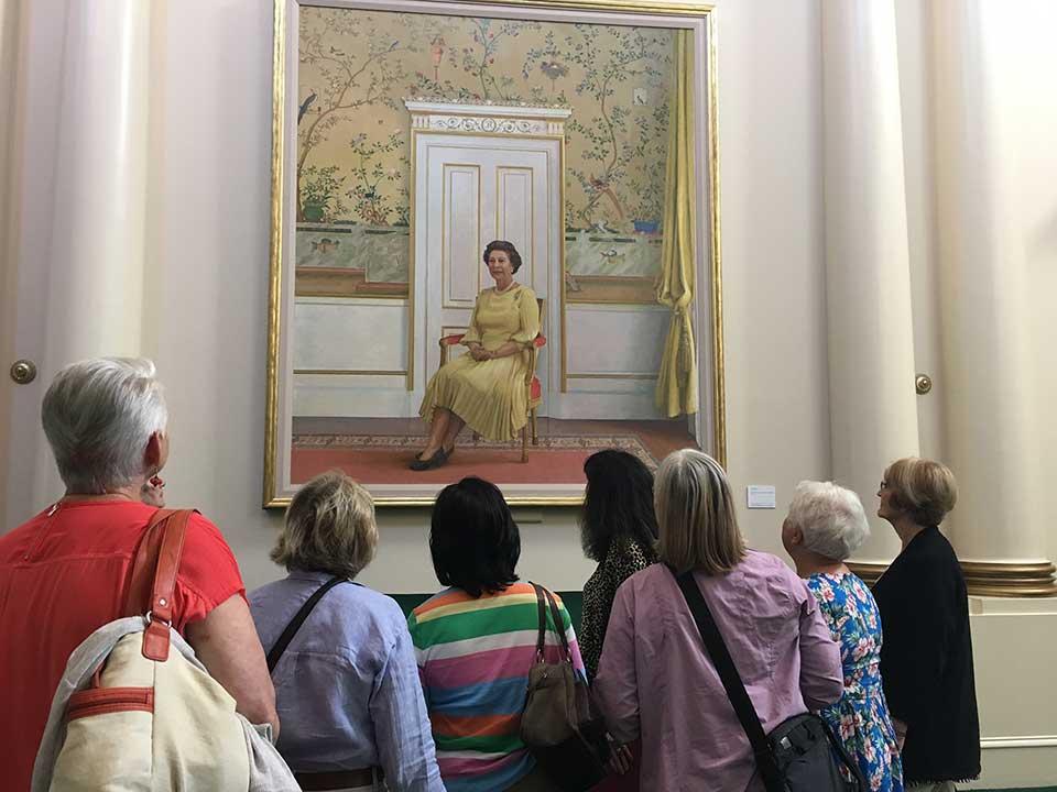 visitors viewing painting of Queen Elizabeth II at Government House